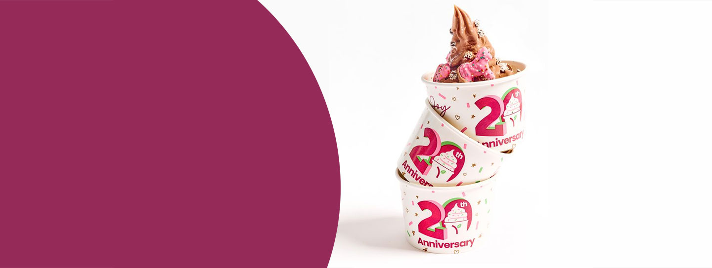 Three stacked cups of Yogurtland frozen yogurt.