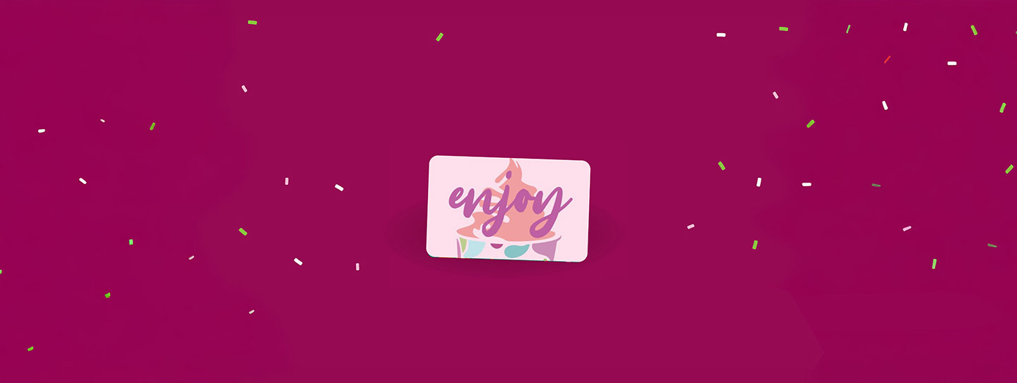 A group of Yogurtland cups of frozen yogurt and toppings